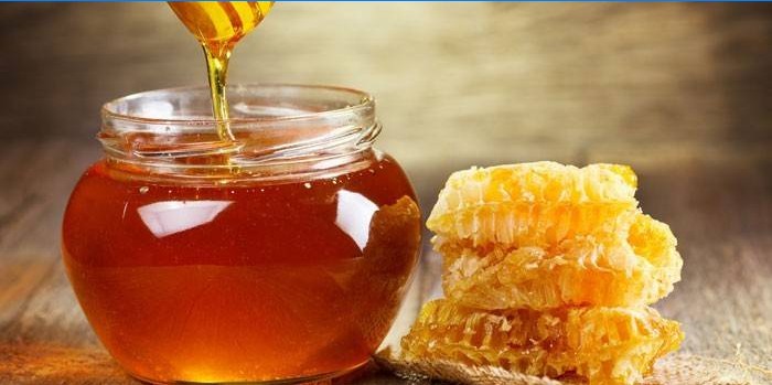 Medus stiklainyje ir koriai