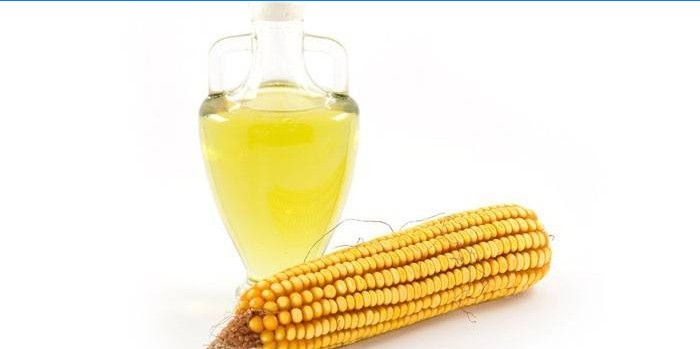 Kukurūzų ir kukurūzų aliejus stikliniame inde